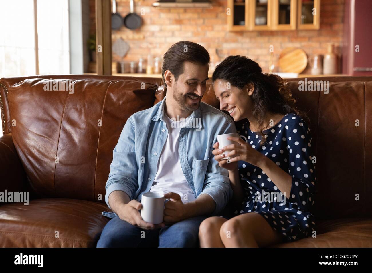 Happy couple drinking morning coffee together at home Stock Photo