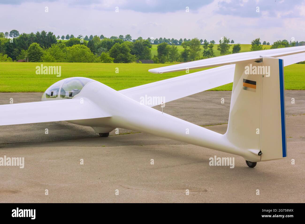 White glider. Sailplane on aeroclub airport. Stock Photo