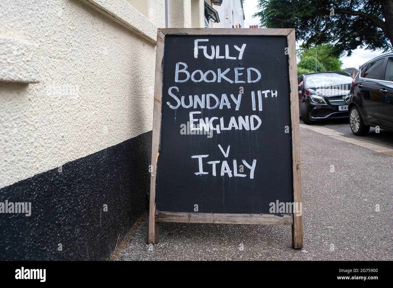 Windsor, Berkshire, UK. 11th July, 2021. A fully booked sign outside a pub in Windsor today ahead of the UEFA Euro 2020 final tonight between England v Italy. Credit: Maureen McLean/Alamy Live News Stock Photo