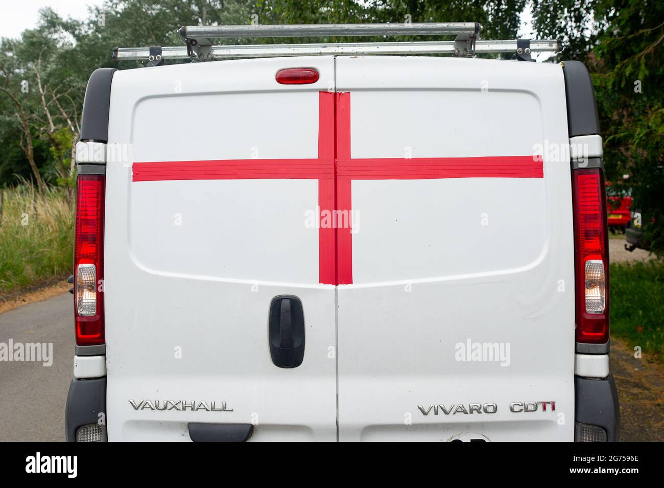 Windsor, Berkshire, UK. 11th July, 2021. A van has an England St George's red cross taped onto the back of it ahead of the UEFA Euro Final tonight between England v Italy. Credit: Maureen McLean/Alamy Live News Stock Photo