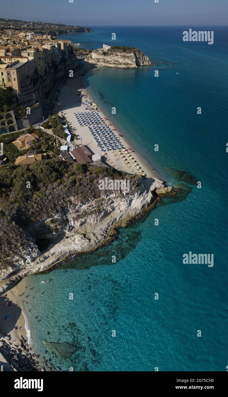 Aerial view of the Calabrian coast, cliffs overlooking the crystal clear sea. Houses on the rock and beach. Tropea. Calabria. Italy. Europe best beach Stock Photo