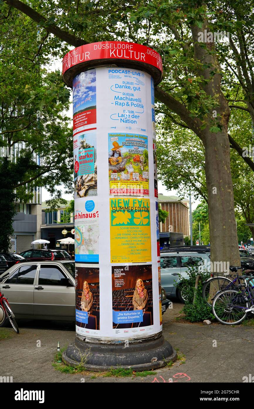 Litfaßsäule (advertising column) on Immermannstrasse in the city center of Düsseldorf. Stock Photo