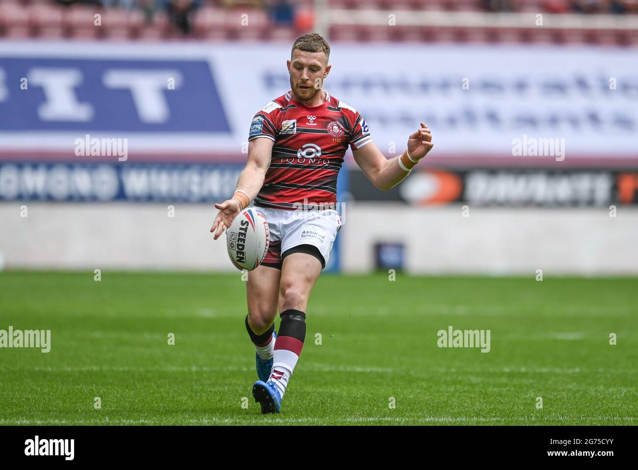 Jackson Hastings (31) of Wigan Warriors kicks the ball up field Stock