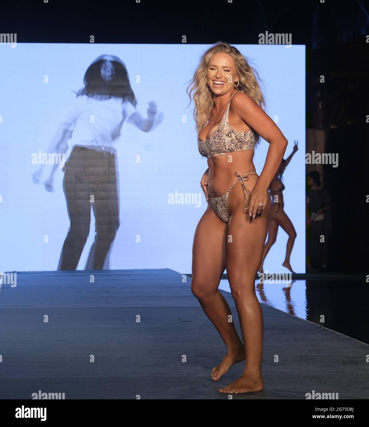 SI Swim Search finalist Kristen Louelle Gaffney, mom of two, unveils curves  on Miami runway: 'Magical moment