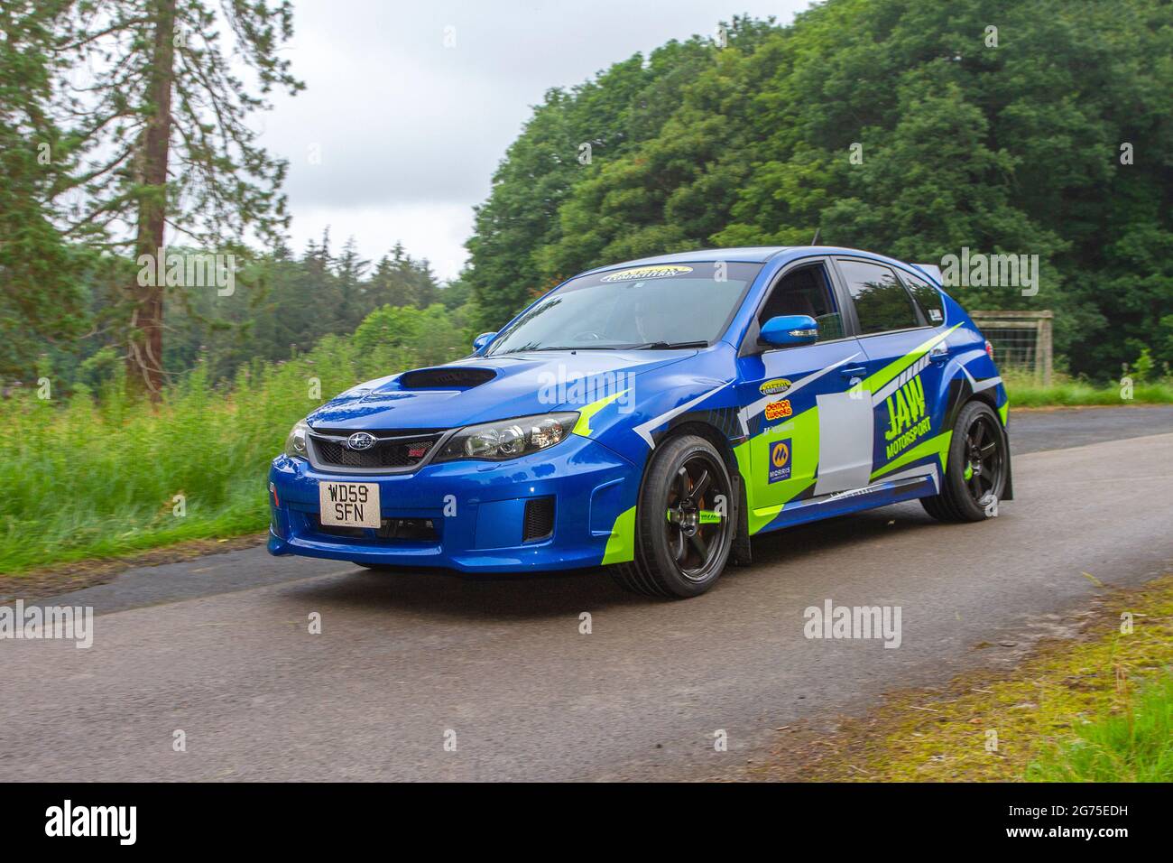 2009 blue Subaru Impreza 19990 cc petrol 'Jaw Motorsport' in racing livery  rally car en-route KLMC The Cars The Star Show in Holker Hall & Gardens,  Grange-over-Sands, UK Stock Photo - Alamy