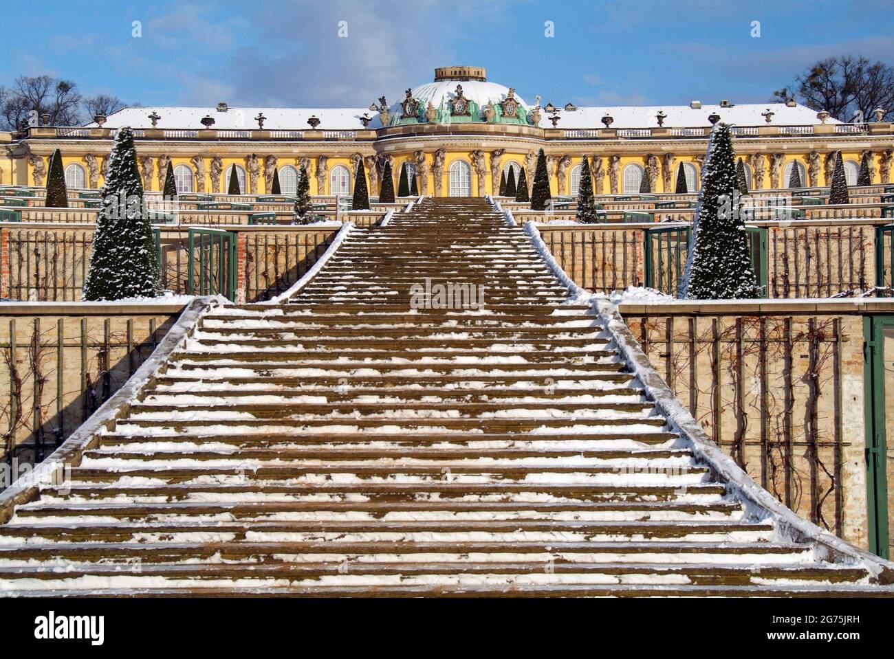 Snow covered Sanssouci Palace and vineyard in Potsdam Stock Photo
