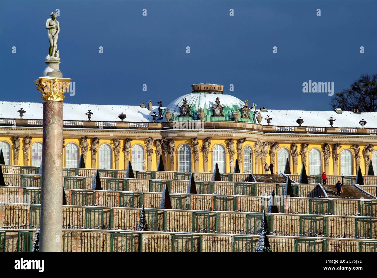Snow covered Sanssouci Castle and vineyard Stock Photo