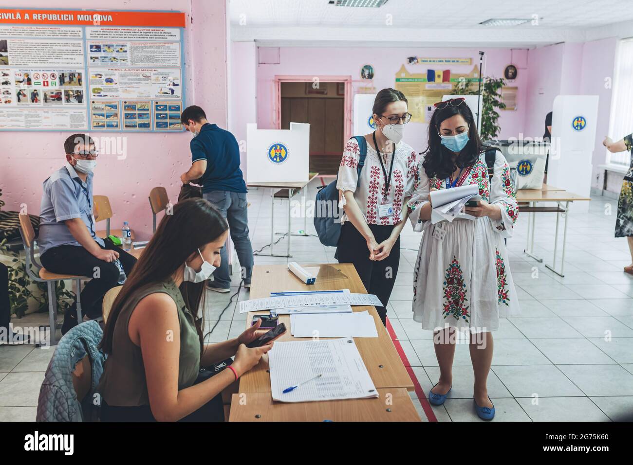 Chisinau, Moldova. 11th July, 2021. Observers of OSCE are seen at a polling station during the parliamentary elections. Credit: SOPA Images Limited/Alamy Live News Stock Photo