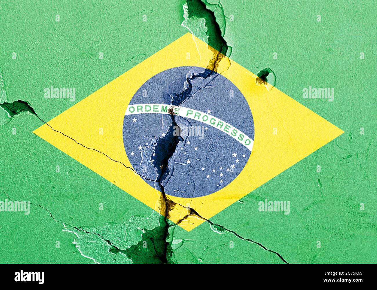 The national flag of Brazil painted on a weathered broken wall - political conflict concept Stock Photo