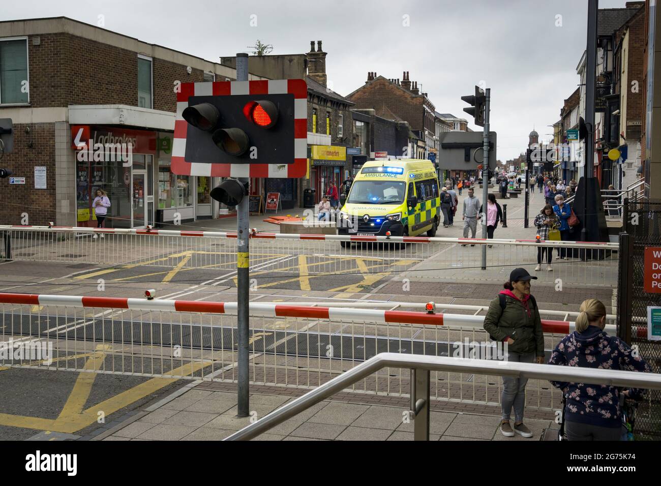 Emergency Ambulance stopped at railway crossing Stock Photo