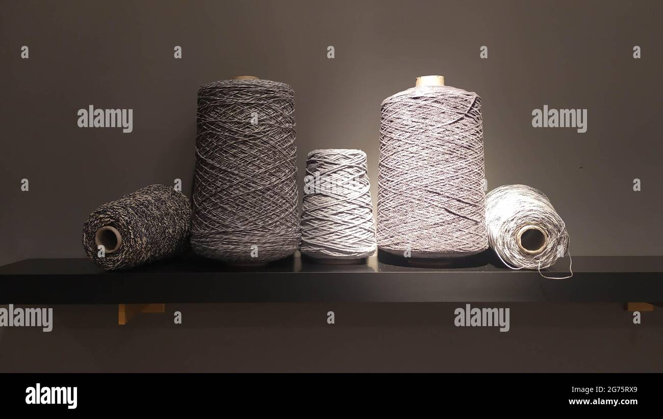 Roll of wool fiber threads, colors analogous to grey Stock Photo - Alamy