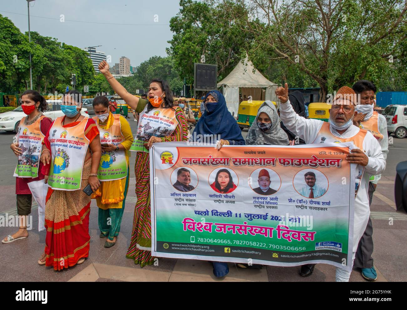 New Delhi India 11th July 21 Savitri Chaudhary National President Of Jansankhya Samadhan Foundation Along With Other Demonstrators Shout Slogans And Hold A Banner During A March On World Population Day At