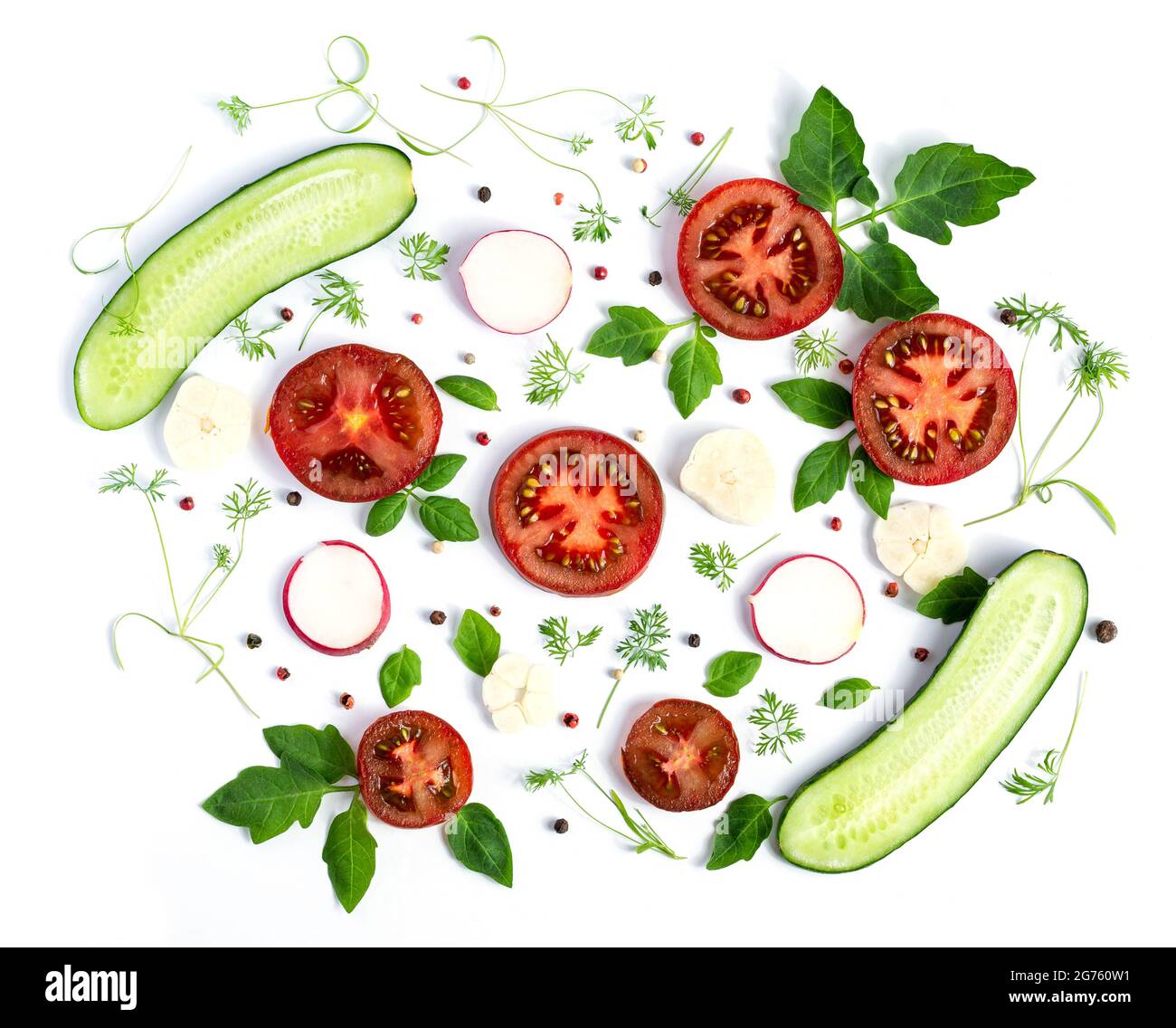 Cucumbers and tomatoes on a white background. Summer vegetarian pattern Stock Photo