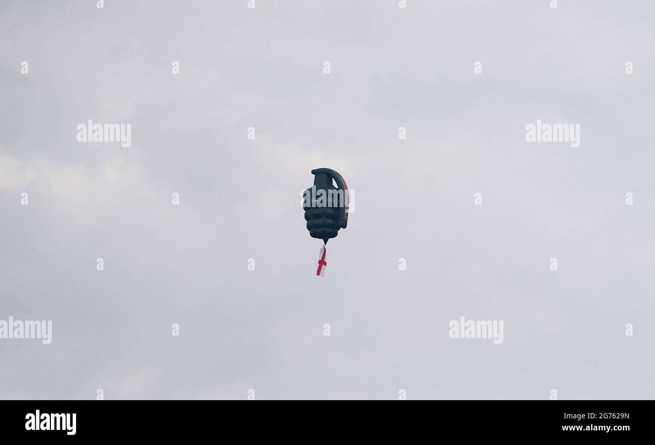 A hot air baloon shaped like a grenade is flown over Manchester as part of a stunt by a nutrition brand ahead of the UEFA Euro 2020 Final between Italy and England. Picture date: Sunday July 11, 2021. Stock Photo