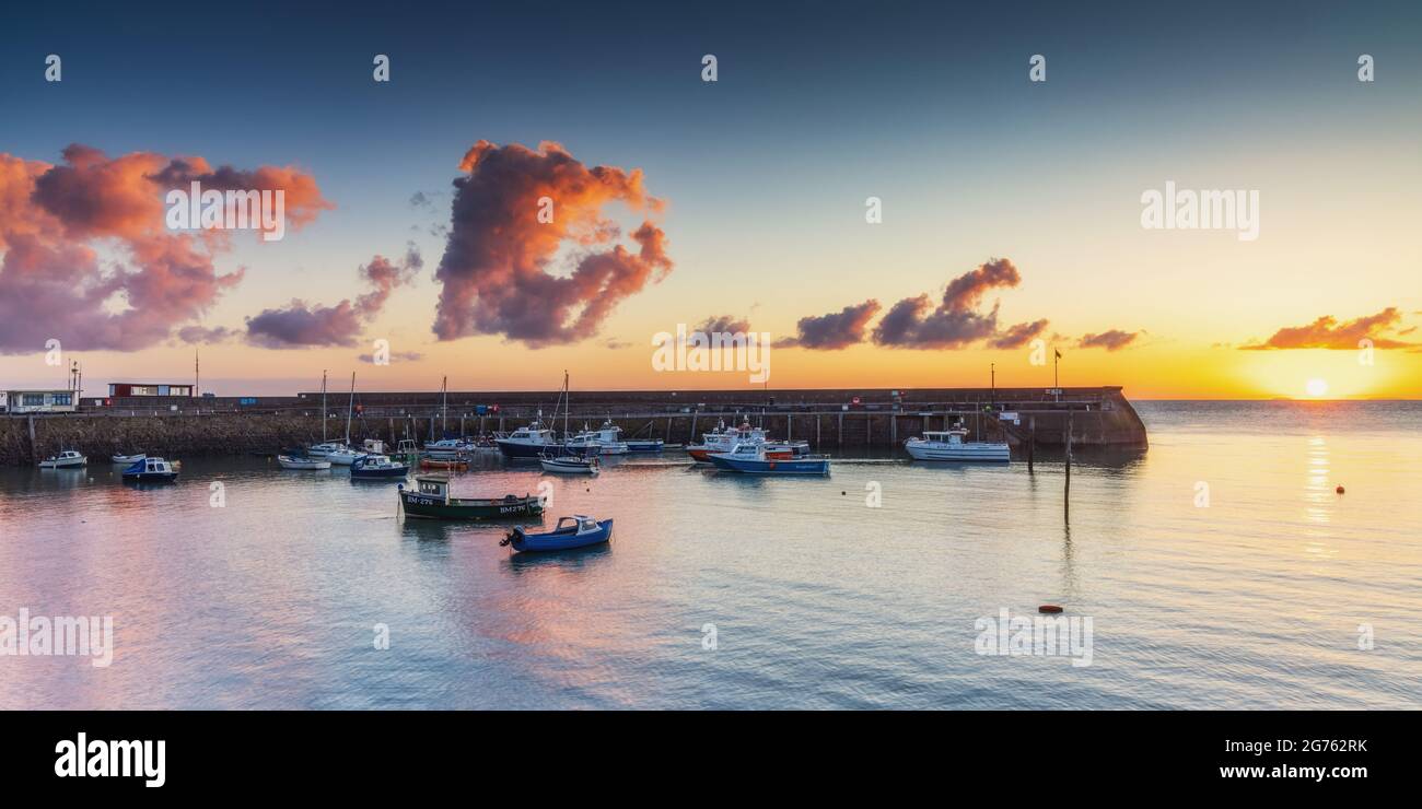 The old harbour at Minehead on the Somerset coast at sunrise. Stock Photo