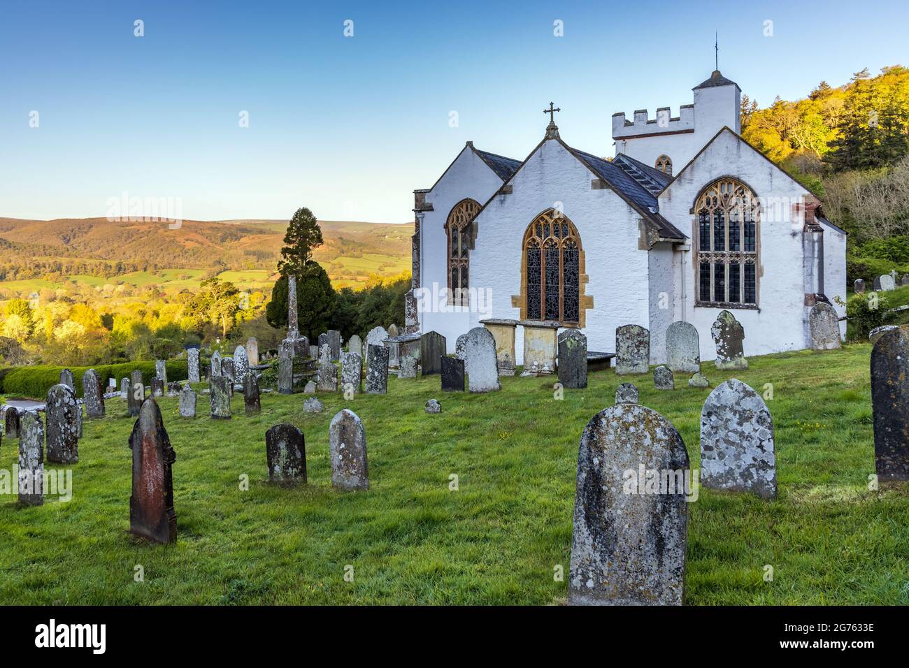 The pretty whitewashed church of All Saints in Selworthy dates back to the 15th century, Exmoor National Park, Somerset. Stock Photo