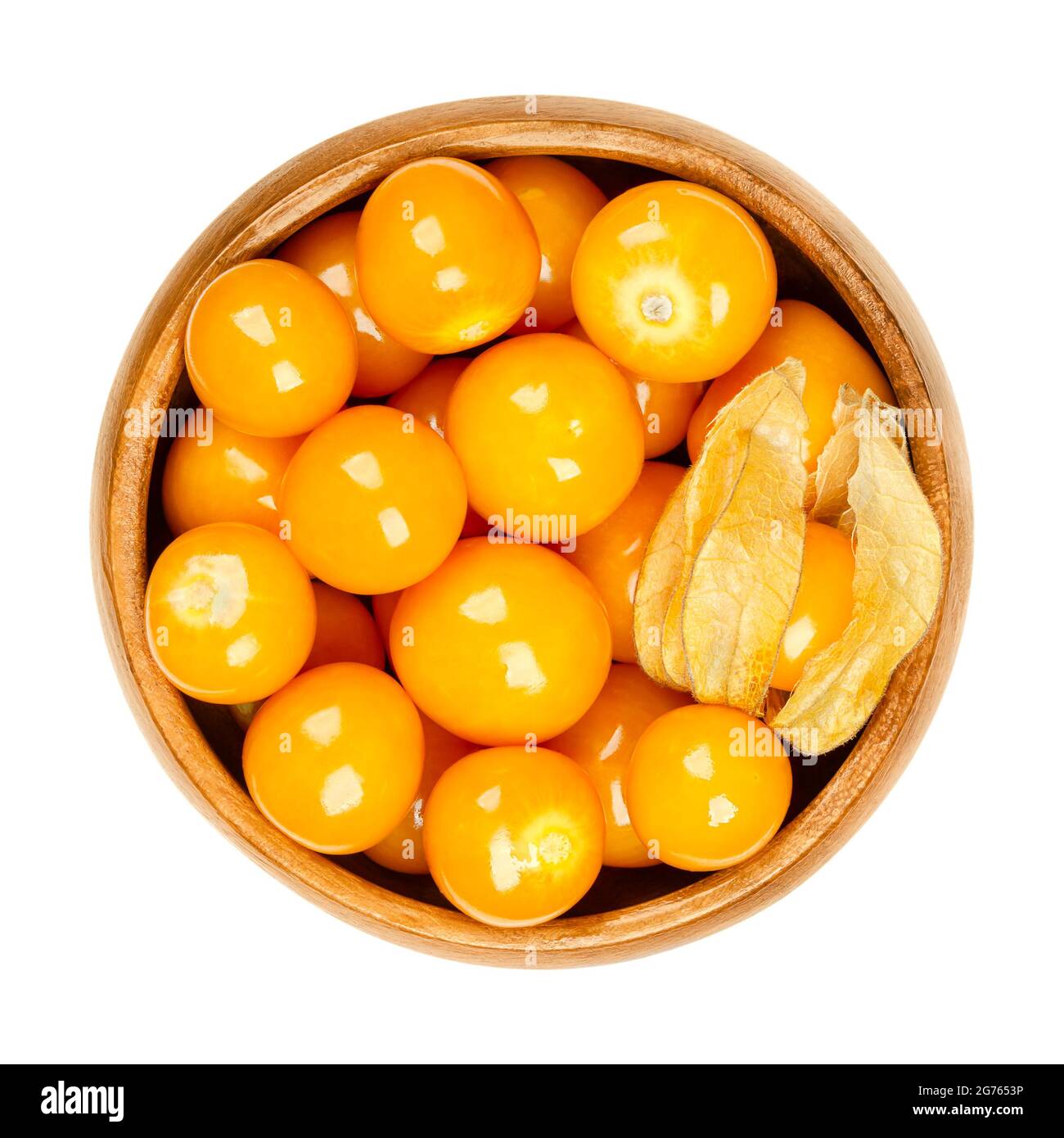 Cape gooseberries in a wooden bowl. Fresh fruits of Physalis peruviana, also known as golden, inca and ground berry, uchuva, poha, and rasbhari. Stock Photo