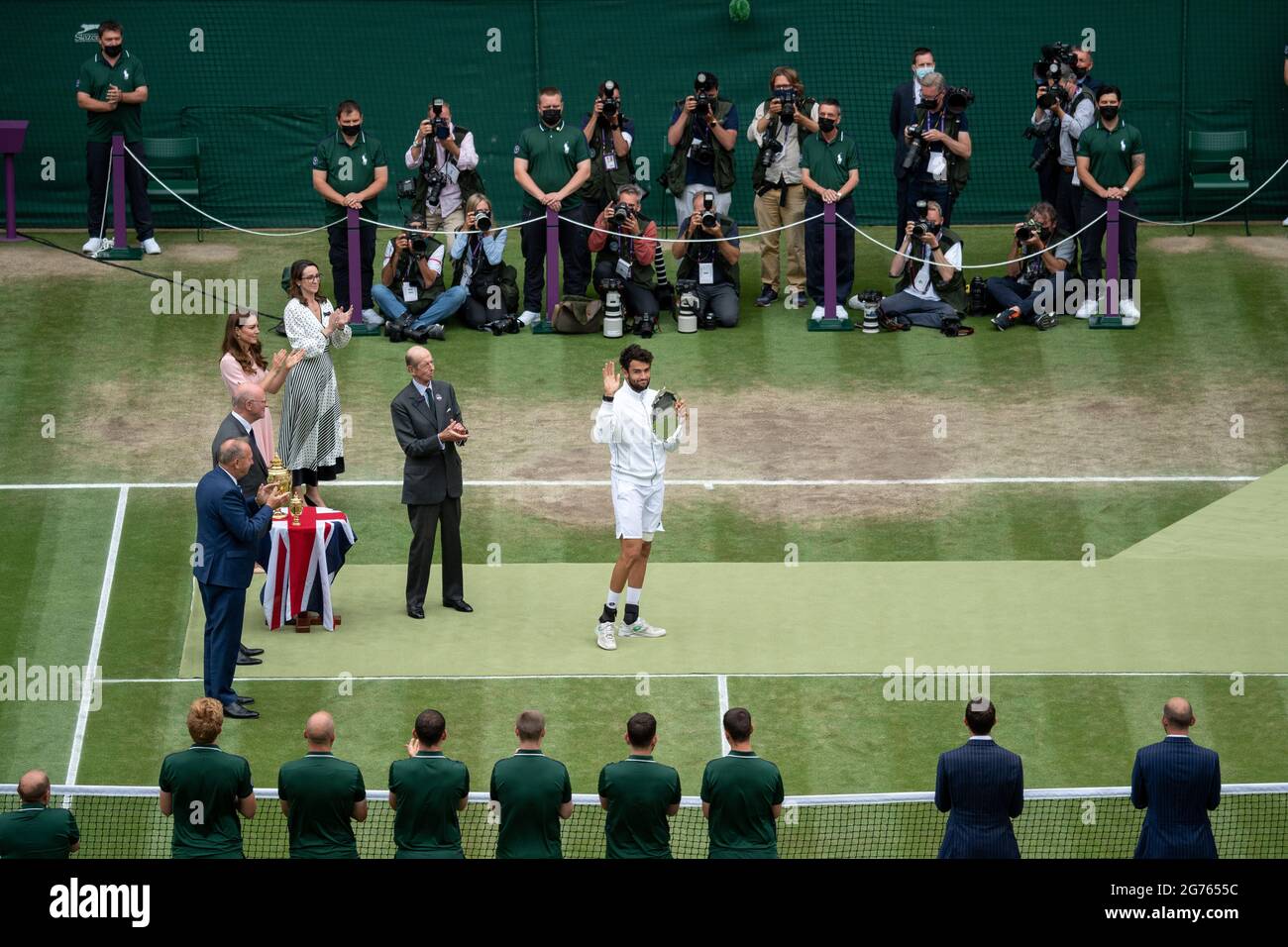 Matteo Berrettini (ITA) steps up to receive the runner-up salver from HRH The Duke of Kent, President of the All England Lawn Tennis Club, after his defeat by Novak Djokovic in the final on centre court on day thirteen of Wimbledon at The All England Lawn Tennis and Croquet Club, Wimbledon. Picture date: Sunday July 11, 2021. Stock Photo