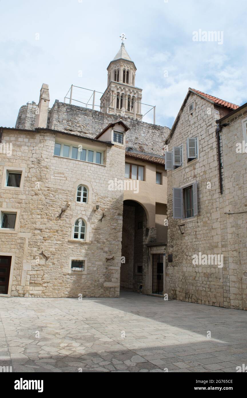 Historic architecture inside the Diocletian's Palace in Split, Croatia, with the view on the top of Cathedral of Saint Domnius bell tower Stock Photo