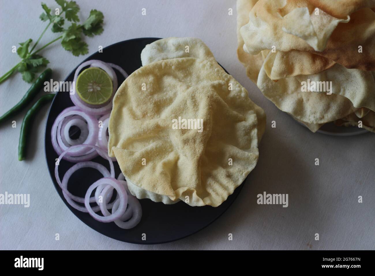 A papadum also called papad is a thin, crisp, round flatbread from