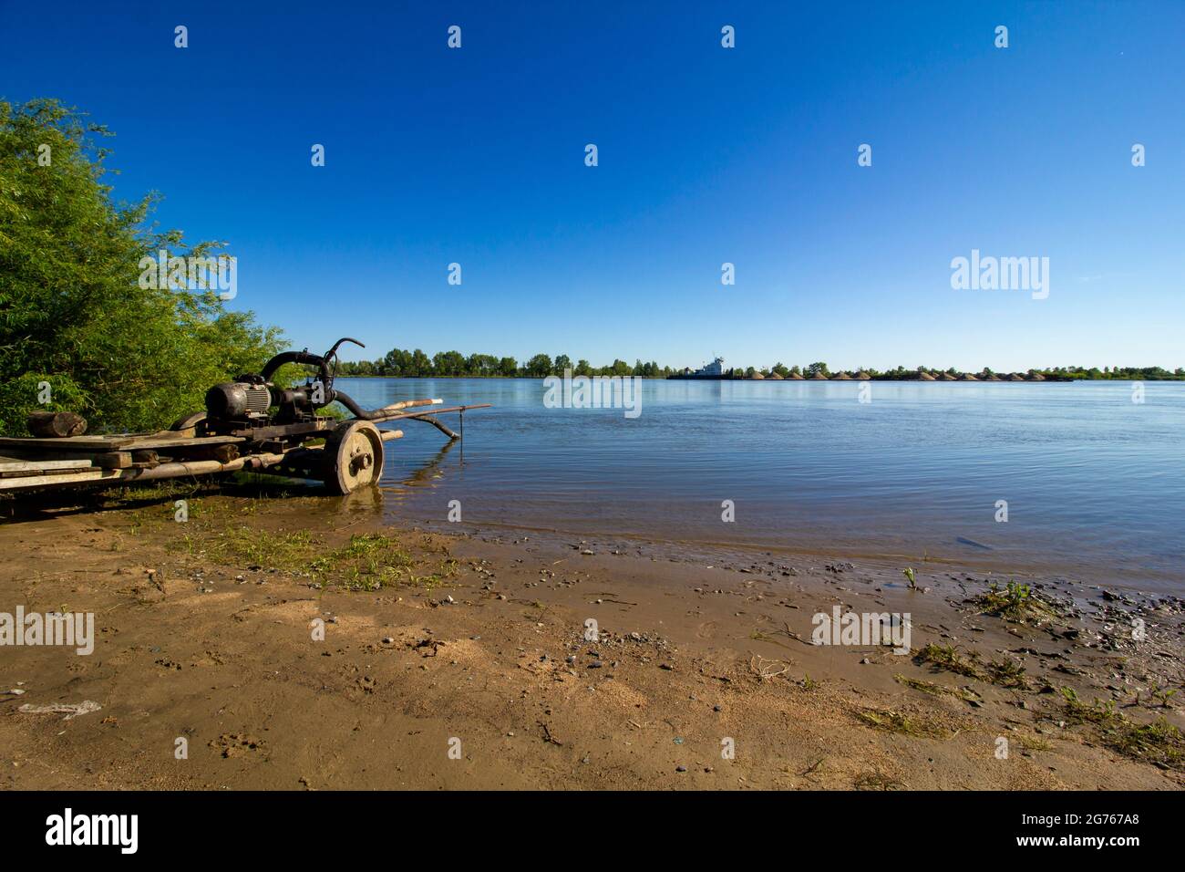 Homemade water pump while working on the riverside. Rustic watering
