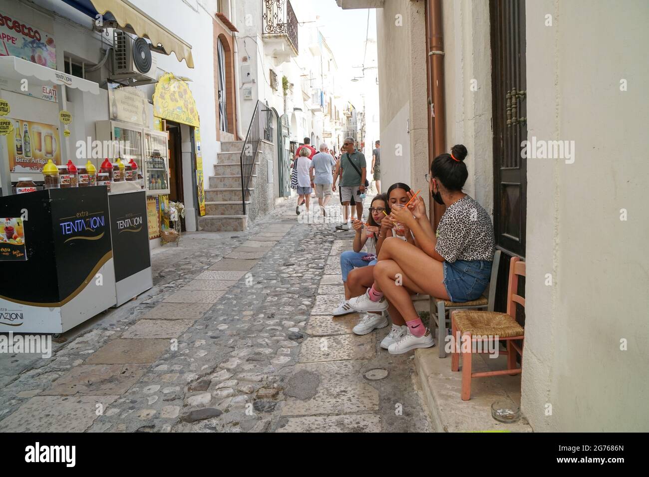Peschici - 29/06/2021: girls enjoying ice cold slush in the street Stock Photo