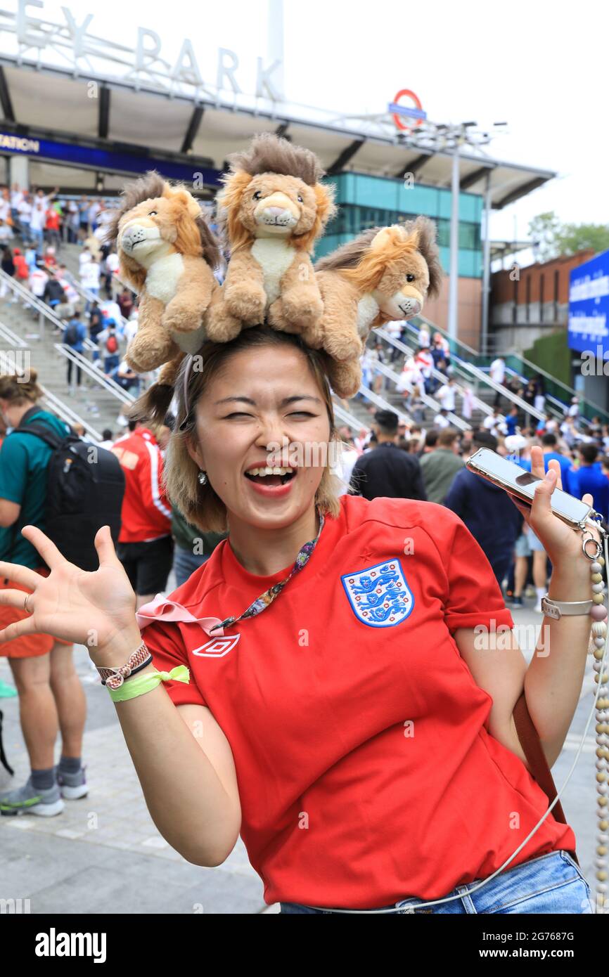 Fan wearing 3 lions on her head at Wembley Park for the UEFA Euros 2020