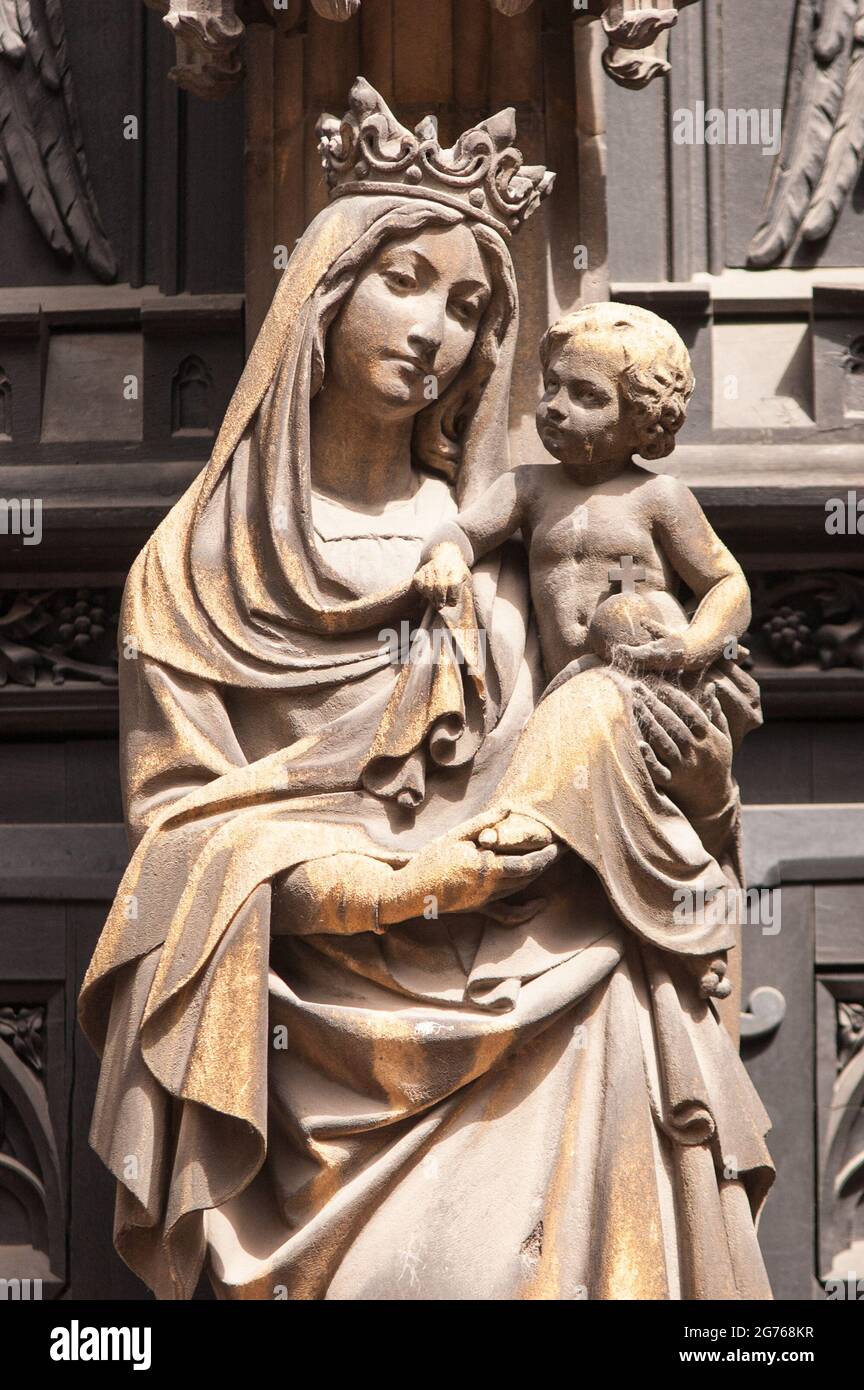 Statue of the Virgin Mary on the gothic façade of St. Martin's Church
