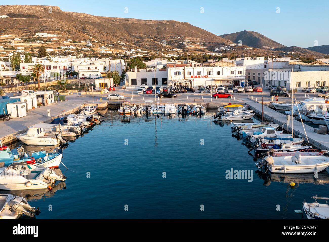 Greece, Paros island. Cyclades. May 25, 2021. Parikia port aerial drone  view. Fishing boats and inflatable vessels anchored at marina dock. Aegean  sea Stock Photo - Alamy