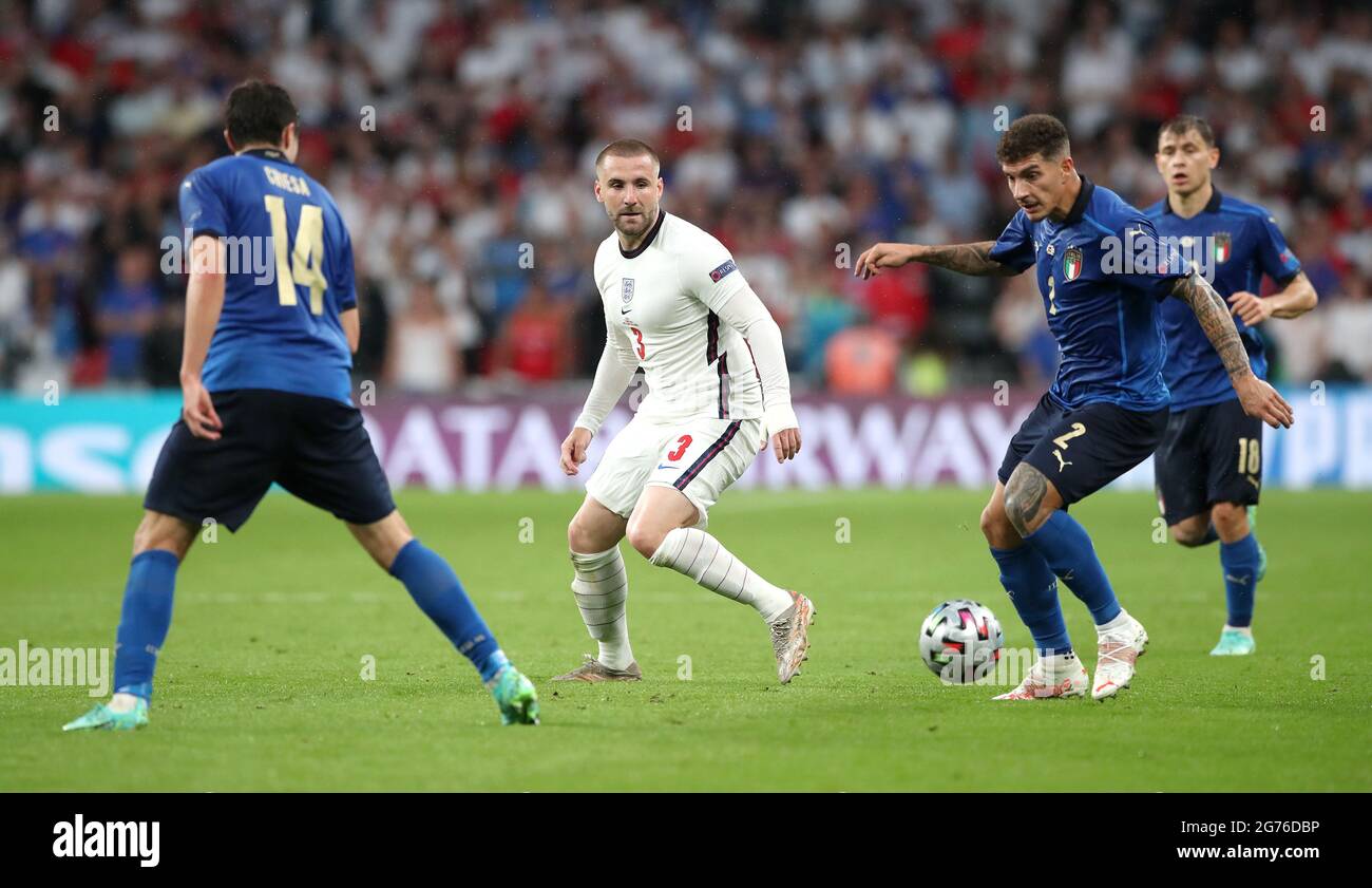 England's Luke Shaw (centre) in action with Italy's Federico Chiesa (left), Giovanni Di Lorenzo (centre) Nicolo Barella during the UEFA Euro 2020 Final at Wembley Stadium, London. Picture date: Sunday July 11, 2021. Stock Photo