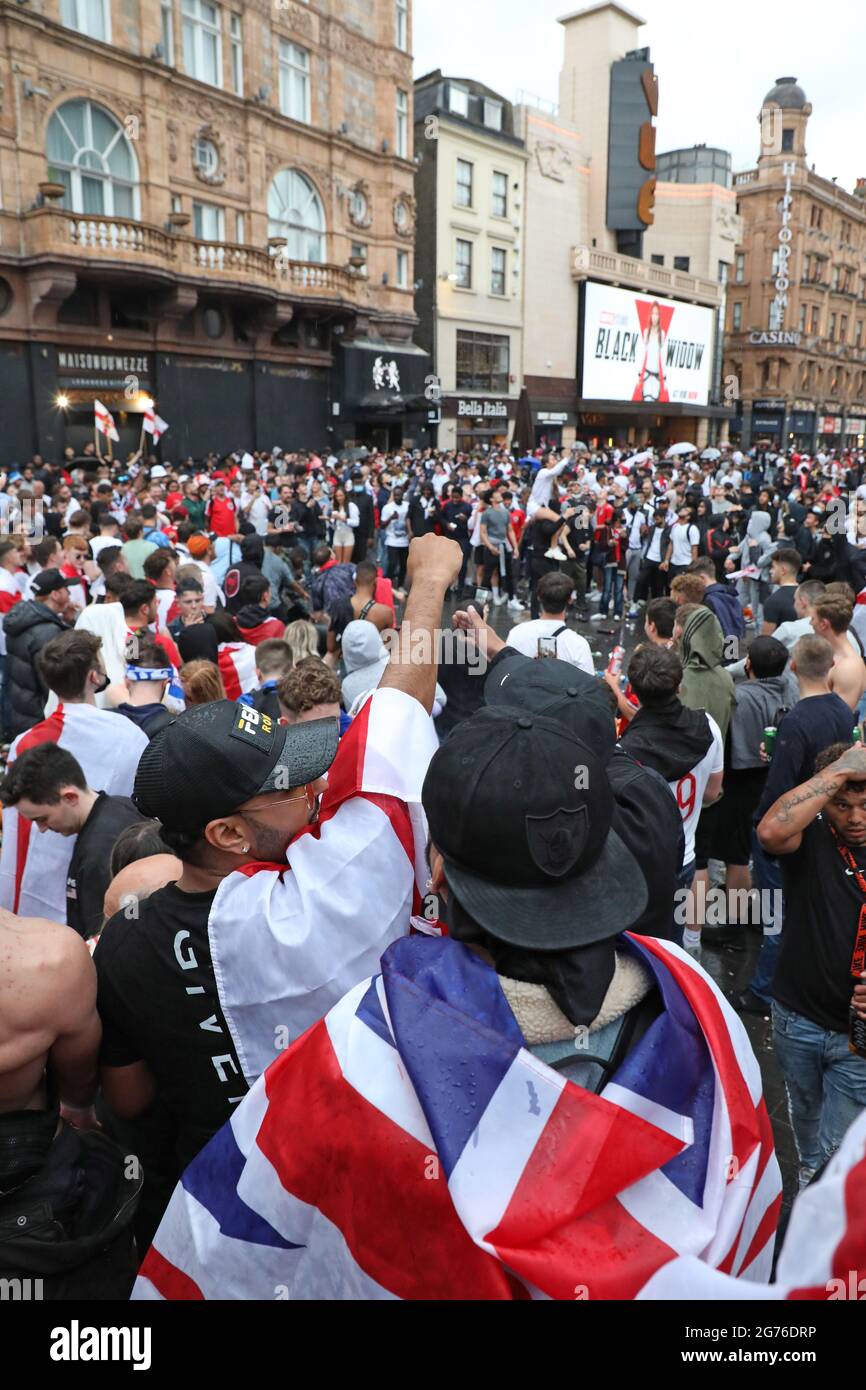 London, UK. 11th July, 2021. England football fans celebrating in Leicester Square ahead of the Italy v England Euros 2000 final in Leicester Square, London, and creating a huge amount of rubbish. Credit: Paul Brown/Alamy Live News Stock Photo