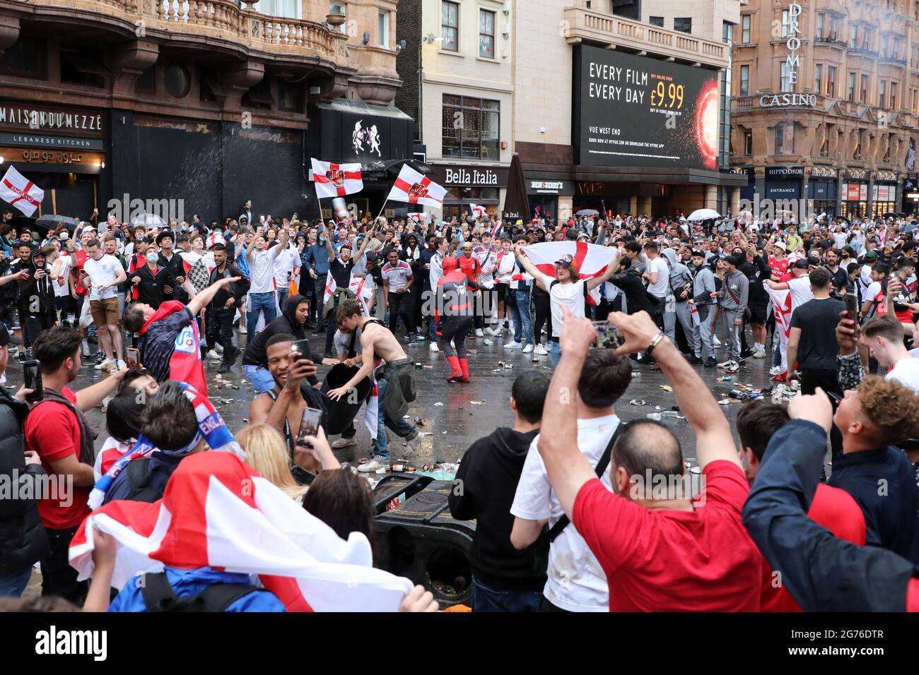 London, UK. 11th July, 2021. England football fans celebrating in Leicester Square ahead of the Italy v England Euros 2000 final in Leicester Square, London, and creating a huge amount of rubbish. Credit: Paul Brown/Alamy Live News Stock Photo
