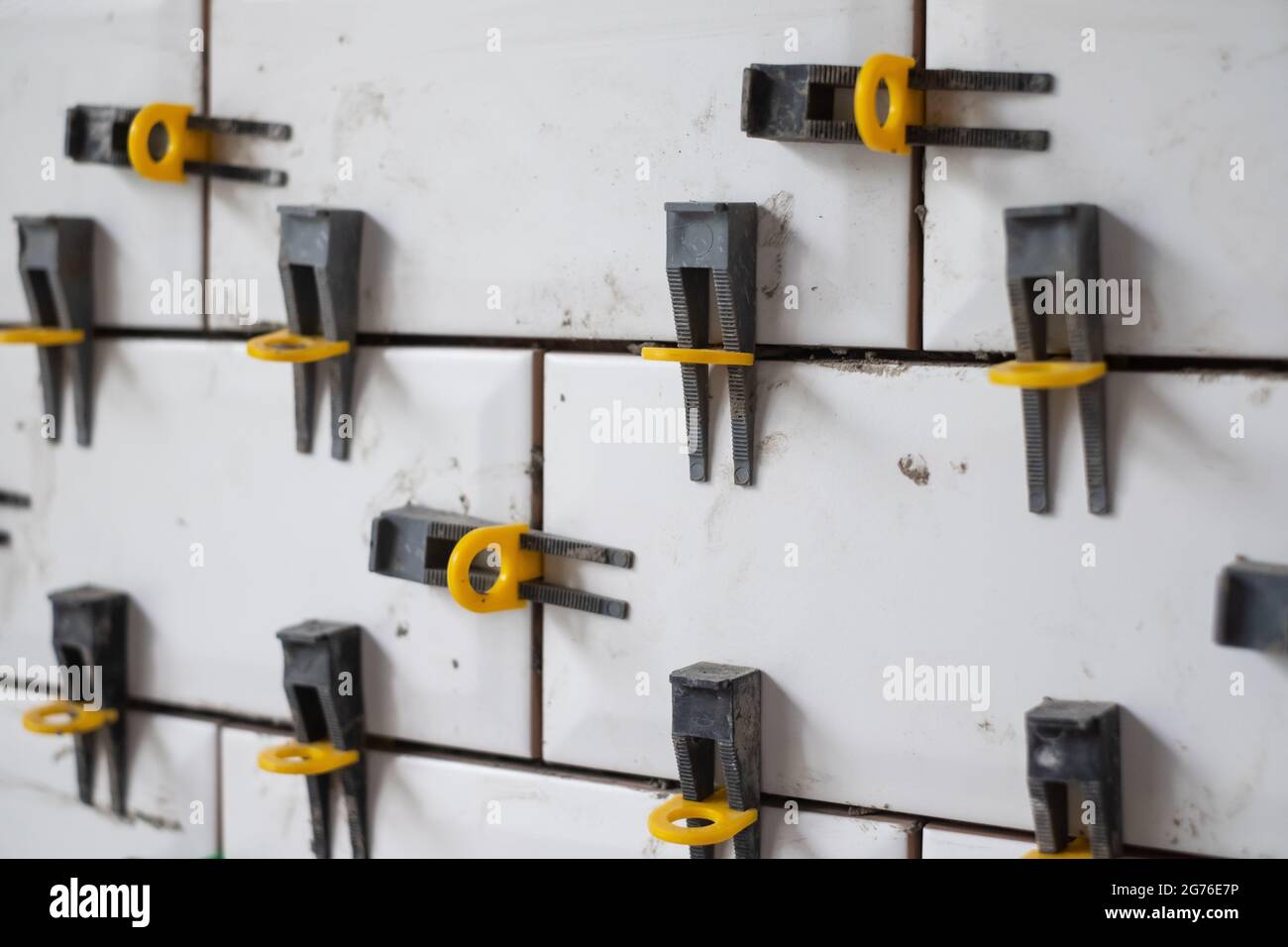 View on tile leveling system with plastic clips and wedges Stock Photo