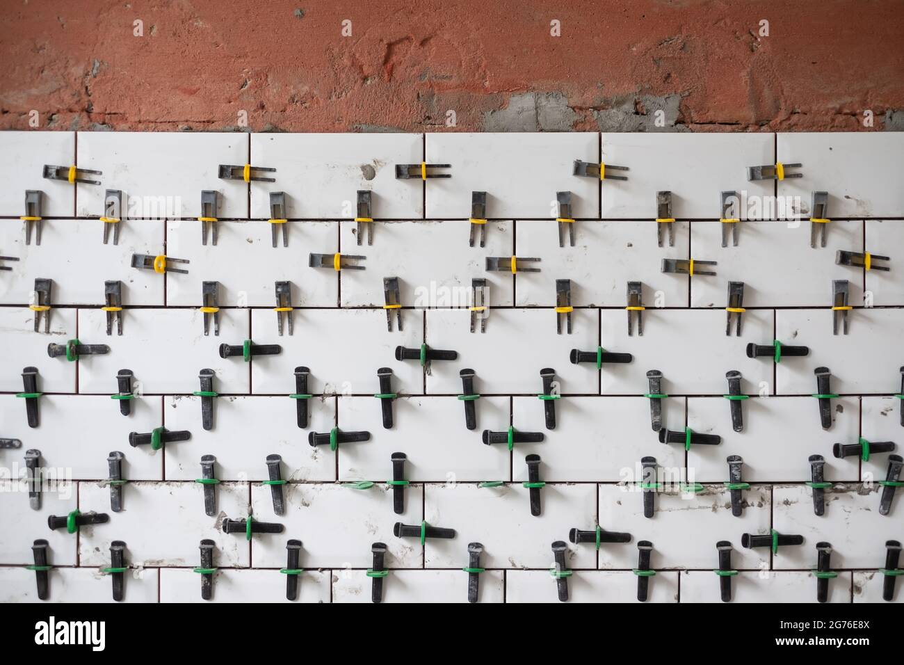 View on tile leveling system with plastic clips and wedges Stock Photo