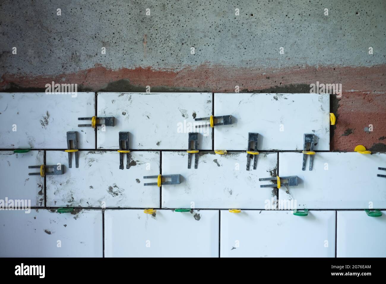View on tile leveling system with plastic clips and wedges Stock Photo