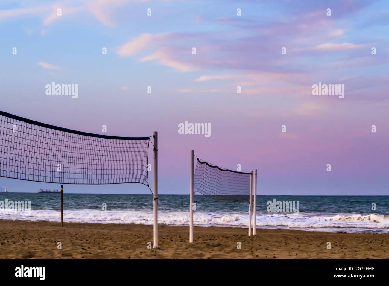 Beach volleyball nets on the shore in Urbanova beach, Alicante, Spain