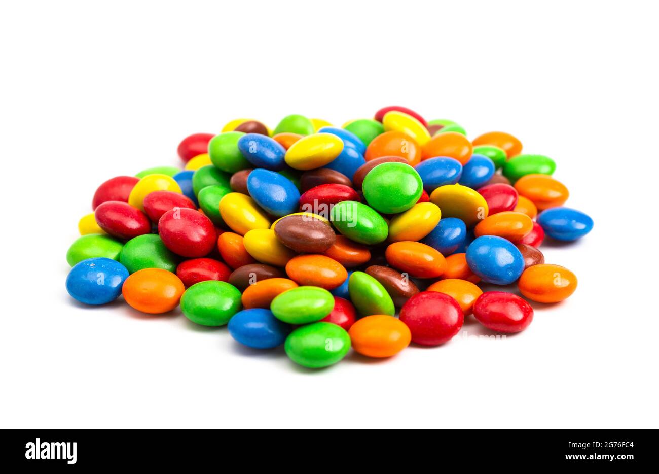 A Pile of Rainbow Colored Candy Coated Chocolate Buttons Isolated on a