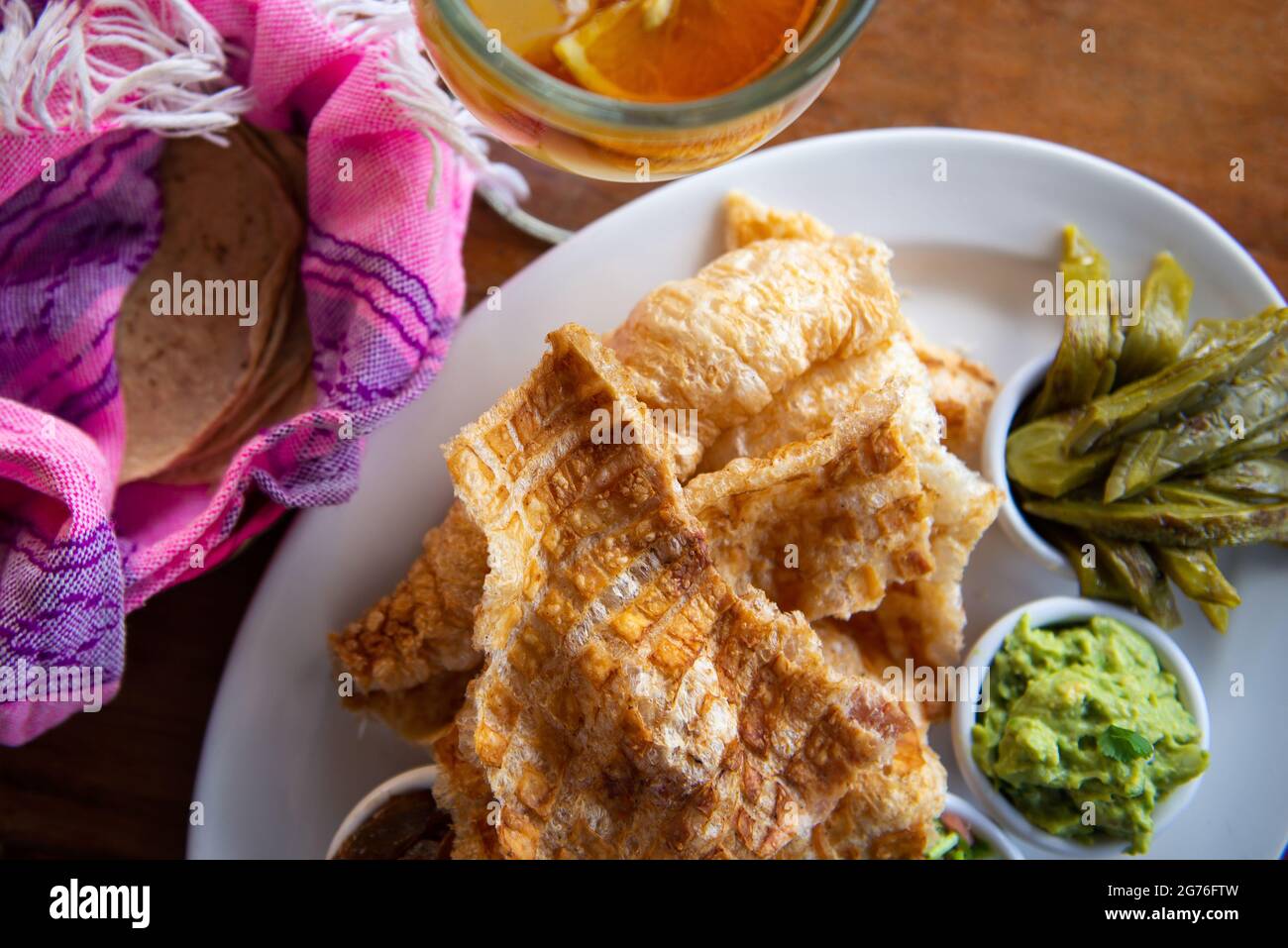 The Mexican Pork rind. Nopales and guacamole. Mexican food on wooden background Stock Photo Alamy