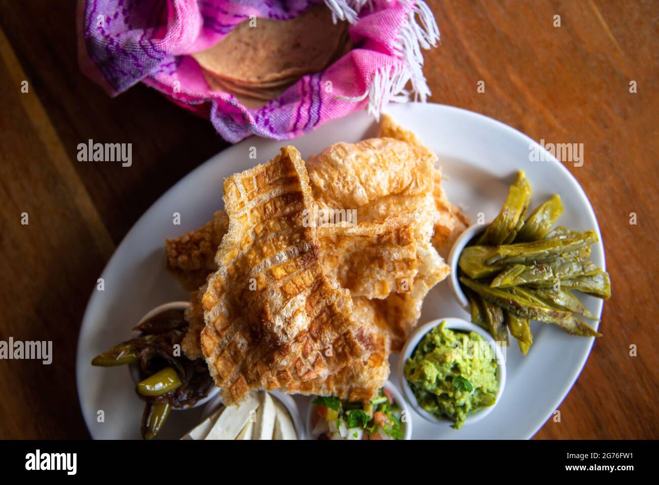 The Mexican Pork rind. Nopales and guacamole. Mexican food on wooden background Stock Photo Alamy