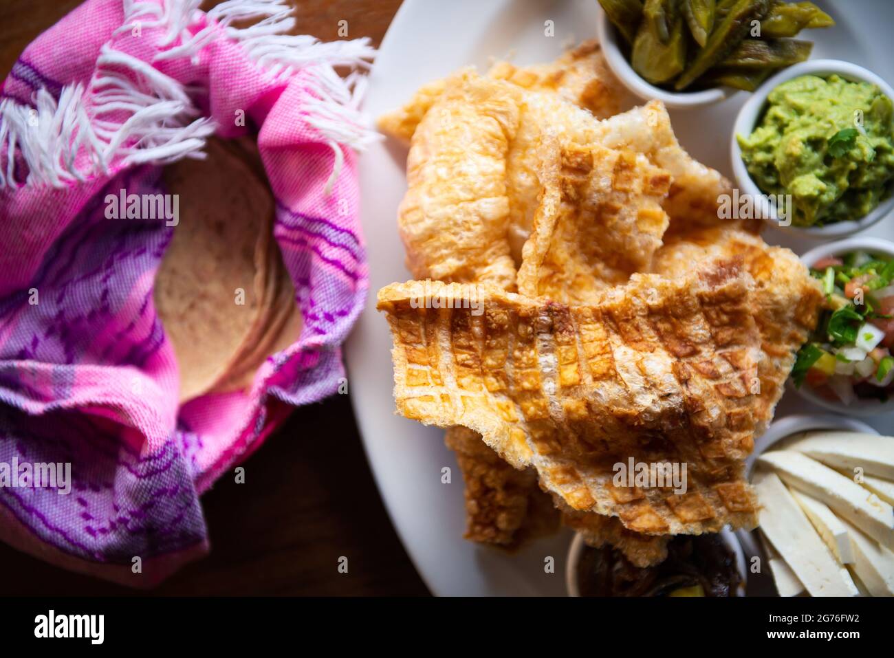 The Mexican Pork rind. Nopales and guacamole. Mexican food on wooden background Stock Photo Alamy