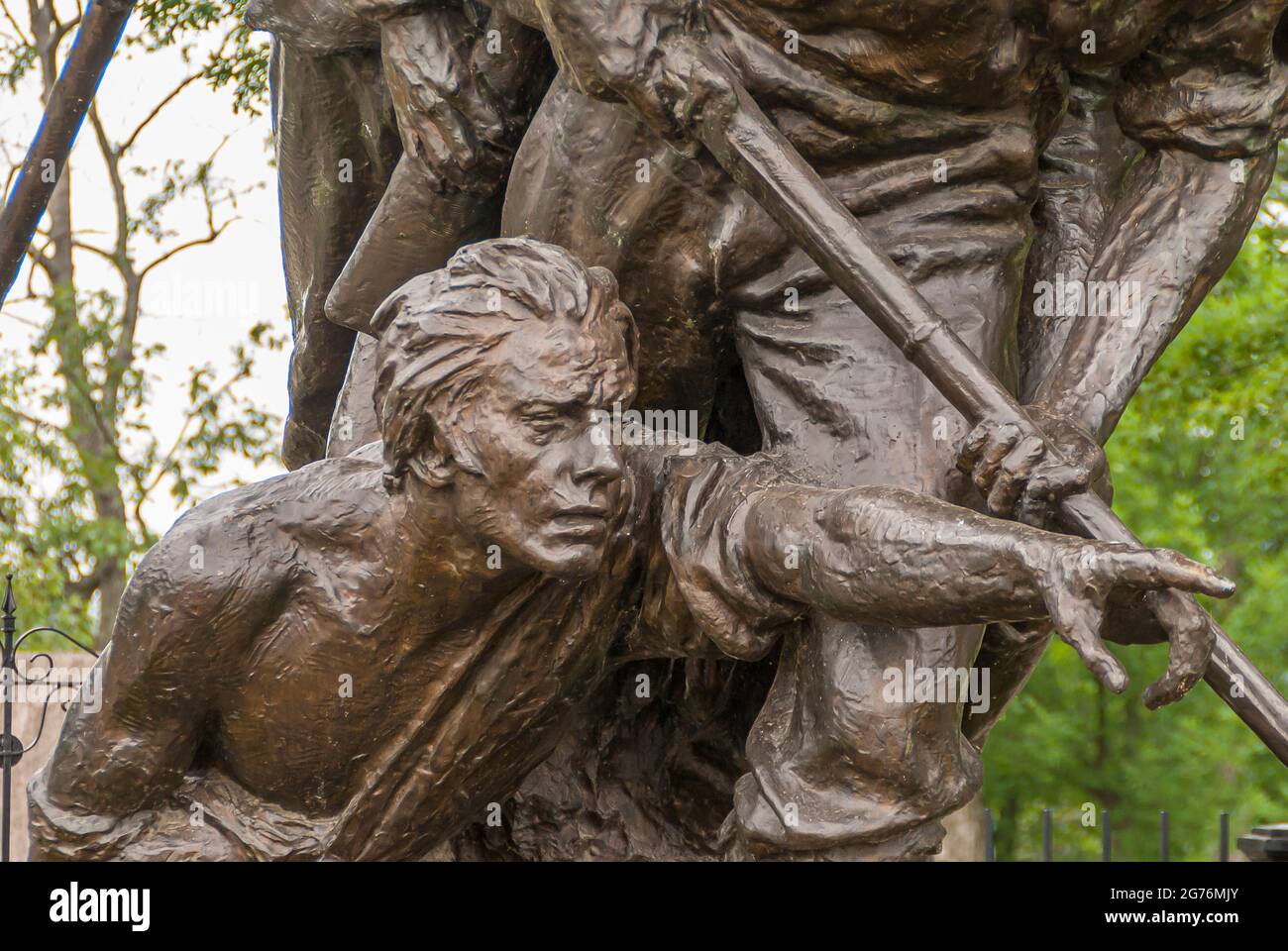 Gettysburg, PA, USA - June 14, 2008: Battlefield monuments. Closeup of detail of the North Carolina State monument showing the wounded soldier pointin Stock Photo