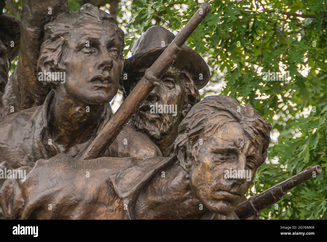 Gettysburg, PA, USA - June 14, 2008: Battlefield monuments. Closeup of detail of the North Carolina State monument showing 3 soldiers looking at the l Stock Photo