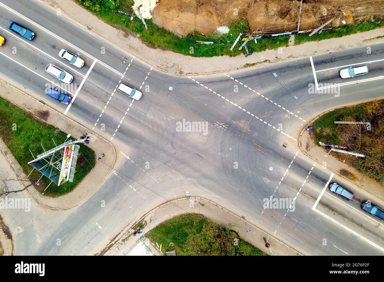 Top down aerial view of busy street intersection with moving cars ...