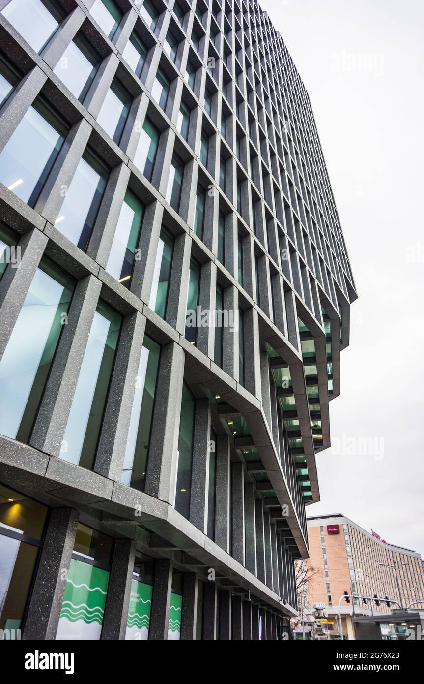 POZNAN, POLAND - Nov 16, 2018: A low angle shot of the modern Baltyk office building with many windows in the Roosevelta street Stock Photo