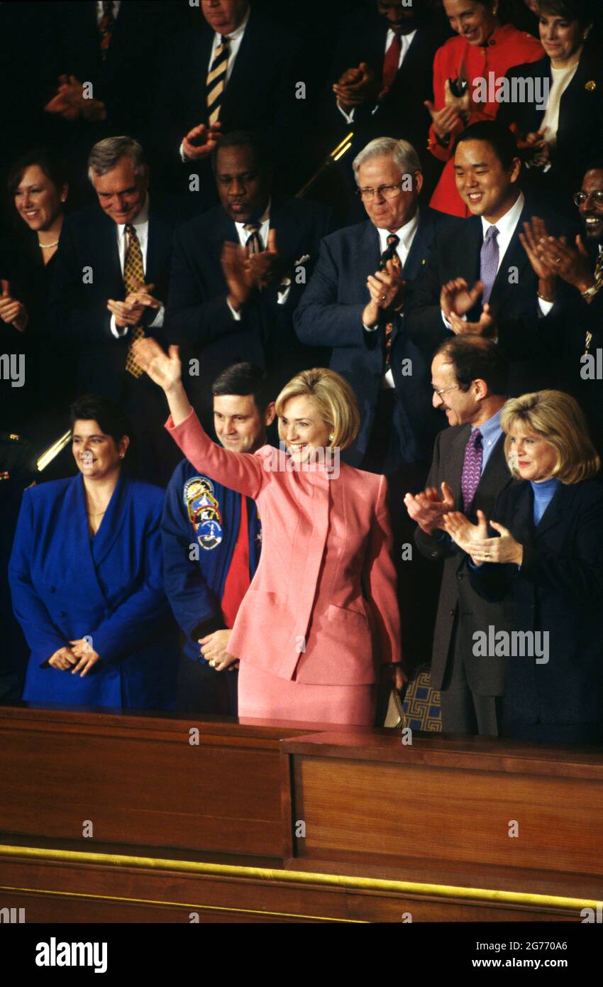 Washington, DC, USA. 27th January 1998. U.S. First Lady Hillary Rodham Clinton waves from the gallery shortly before the start of the annual State of the Union address to Congress on Capitol Hill January 27, 1998 in Washington, D.C. NASA Shuttle Commander Colonel Robert Cabana, left, Director of the National Institutes for Health Dr. Harold Varmus, center, and Tipper Gore, wife of Vice President Al Gore, right, look on. Stock Photo