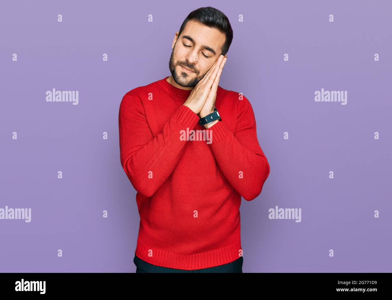 Young hispanic man wearing casual clothes sleeping tired dreaming and ...