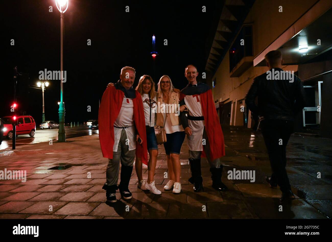 Brighton UK 11th July 2021 - England football fans still smiling as they head home in Brighton after watching the defeat on penalties to Italy in the EURO 2020 final  : Credit Simon Dack / Alamy Live News Stock Photo