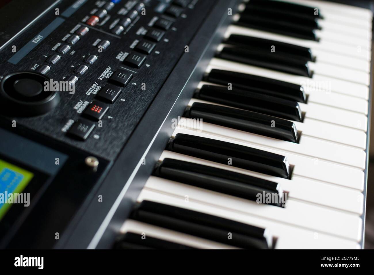Closeup of keyboard synthesizer. Keys, buttons and knobs and the display of the instrument. Stock Photo
