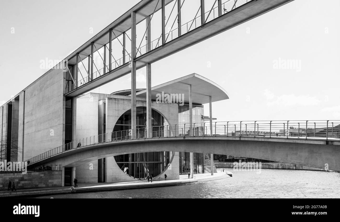 Grayscale shot of the Marie-Elisabeth-Luders building footbridge over the Spree River Stock Photo