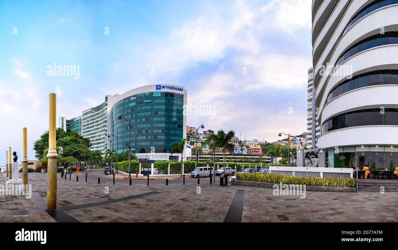 Puerto Santa Ana boulevard in Guayaquil, Ecuador. Many people walking along  the malecon in front of the river. The Point and Wyndham Hotel Stock Photo  - Alamy
